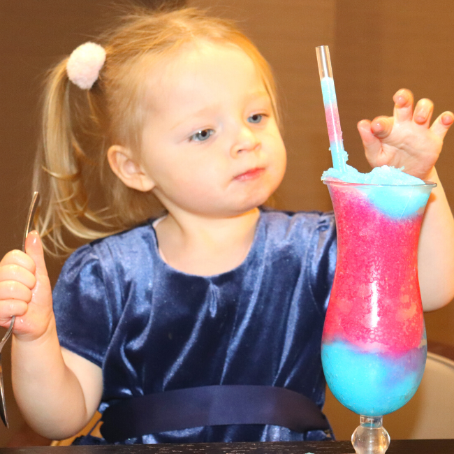 A young child enjoying a Tango Ice Blast